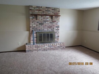 Family room accented by fireplace