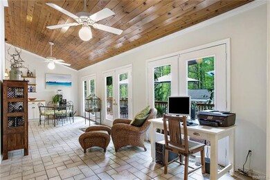 Sunroom overlooks private rear yard