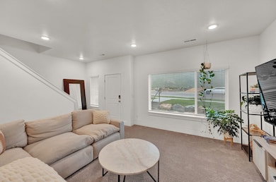 Living room with carpet flooring and recessed lighting