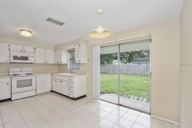 Dining Room overlooks large Fenced Back Yard!