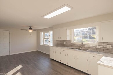 Updated eat-in kitchen with white cabinetry!