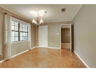 Photo. Large dining room has lots of natural light