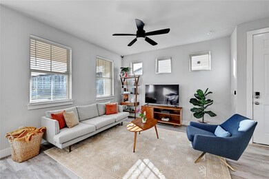 Living room with wood finished floors, baseboards