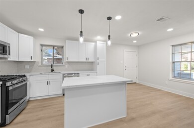 Remodeled kitchen with plenty of light. Recess lig