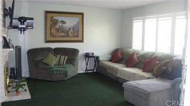 Large picture window with custom shutters in livin