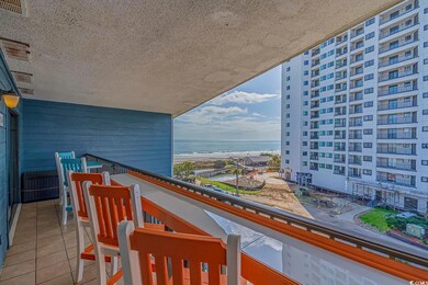 Balcony with a water view and a beach view