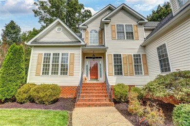 Lovely entry with brick steps and landscaping