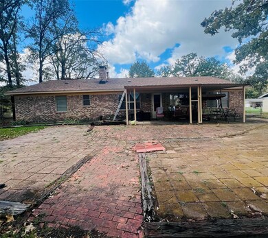 Rear view of house featuring a patio area
