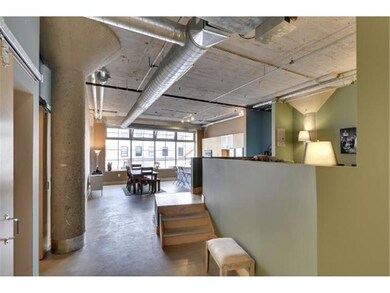 Grand Entrance!  Large windows and concrete & wood