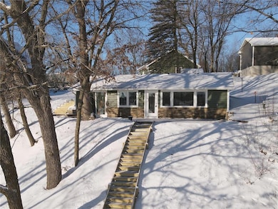 This cabin sits on a large .46 acre wooded lot and