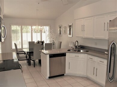KITCHEN LOOKING INTO BREAKFAST ROOM