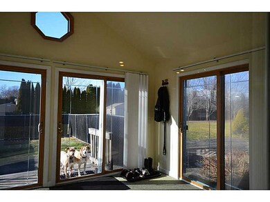 View. 4 Season room off kitchen with view to trees