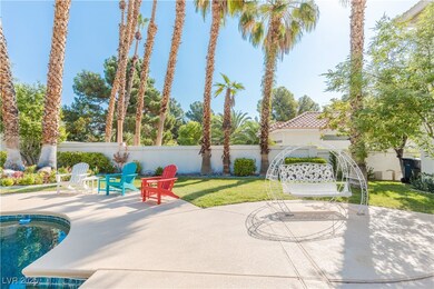 View of patio with a pool and fence