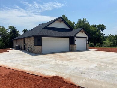 View of property exterior featuring a garage and c