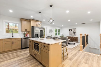 Kitchen featuring visible vents, a sink, a kitchen