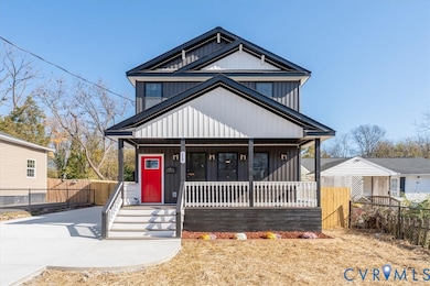 View of front facade featuring covered porch and board and batten siding