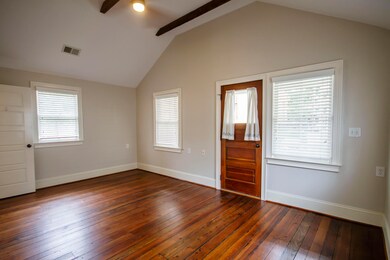 master bedroom w vaulted ceilings