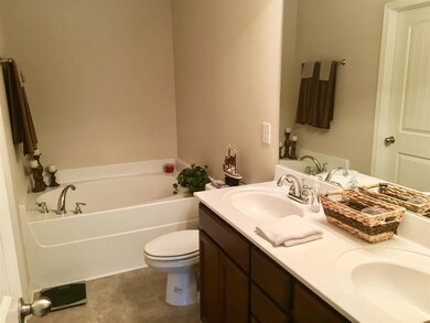 Double vanity, garden tub, and separate shower