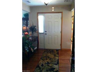 Foyer with hardwood flooring.