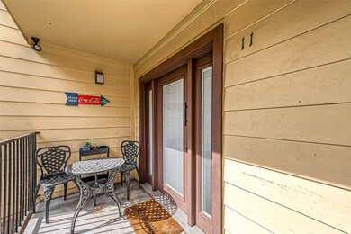 Relax on the lovely front porch. The condo has gon