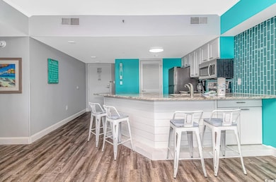 Kitchen featuring hardwood / wood-style flooring, 