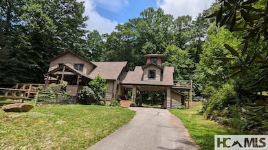 Asphalt Drive into Covered Parking