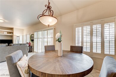 Dining space with light tile patterned flooring