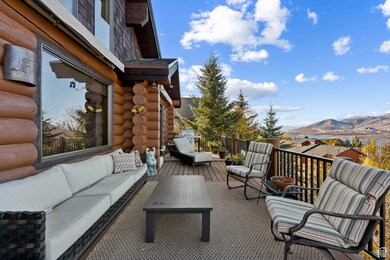 Wooden terrace featuring an outdoor living space and a mountain view