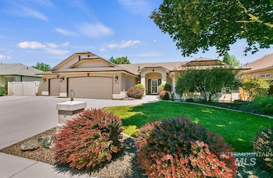 Single story home featuring a front yard, an attached garage, driveway, and stucco siding