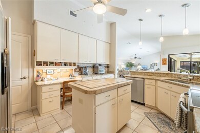 Kitchen with hanging light fixtures, stainless ste