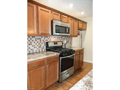 Kitchen has stainless steel appliances.