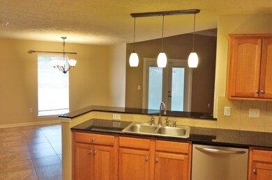 Kitchen opens to dining area