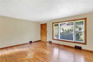 Original hardwood flooring underscores this space.