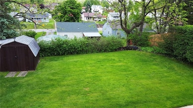 Flat yard with shed.