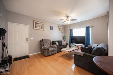 Living room with light wood-type flooring, ceiling