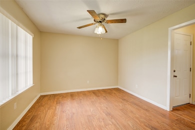 Oversized window illuminates laminate flooring in