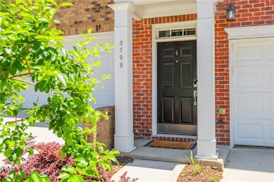 Doorway to property with brick siding and covered porch