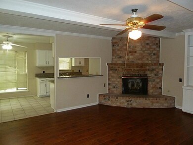 Family Room with Ceiling FanHardwood floorsCorner Fireplace