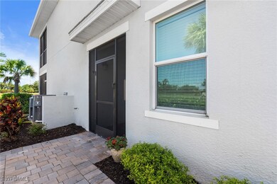 Doorway to property with stucco siding