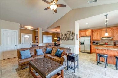 Open concept floor plan with high peaked ceilings.