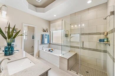 Primary luxury bath with shower and soaking tub