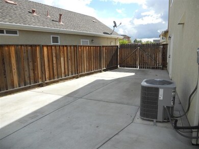 Side parking / storage behind the fence.