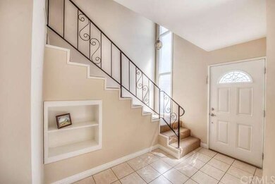 Lovely foyer entrance with tile floors.
