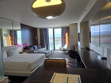 Fully Furnished Hi Rise unit with a kitchen, tv's