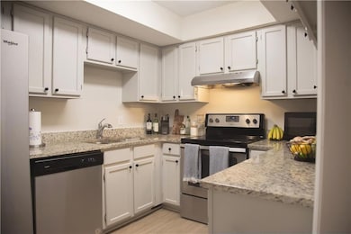 Kitchen with stainless steel appliances, under cab