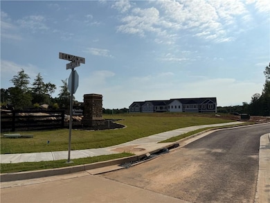 View of home's community with a lawn