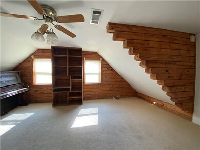 A decorative log feature sets off an upstairs bedr