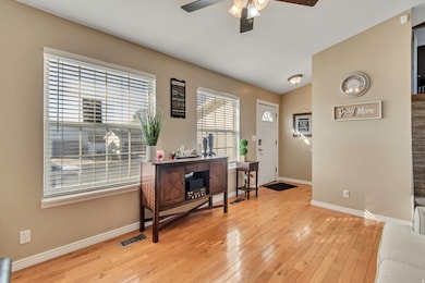 Entryway featuring light wood-style floors and a ceiling fan