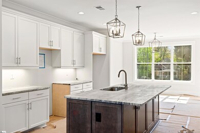 Open to dining and living rooms, view to balcony