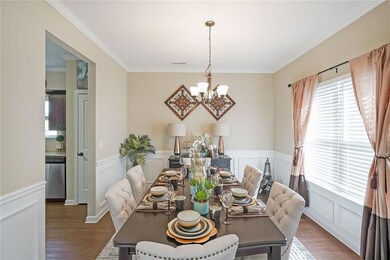 Dining room with a notable chandelier, visible ven